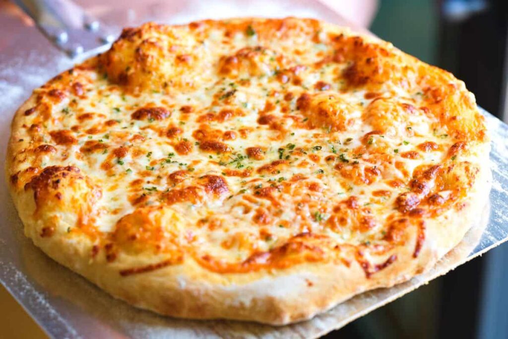 How to Make the Perfect Cheesy Pizza at Home 