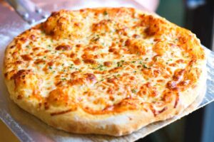 How to Make the Perfect Cheesy Pizza at Home 